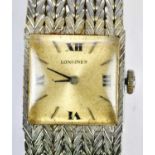 LONGINES; a lady's 18ct white gold wristwatch, the silvered dial set with quarter Roman numerals,