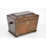 A 19th century rosewood tea caddy with mother of pearl inlay, the hinged cover enclosing two