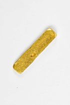 A yellow metal bar of rectangular form, unmarked, length 4cm, approximate weight 17.7g. Condition