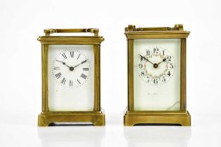 Two French brass cased carriage clocks, including an example with Arabic numerals and floral detail,