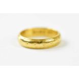 A 22ct yellow gold wedding band, size K, approx. 5.55g.