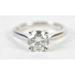 A platinum and diamond single stone ring, the four claw set round brilliant cut diamond approx. 1.