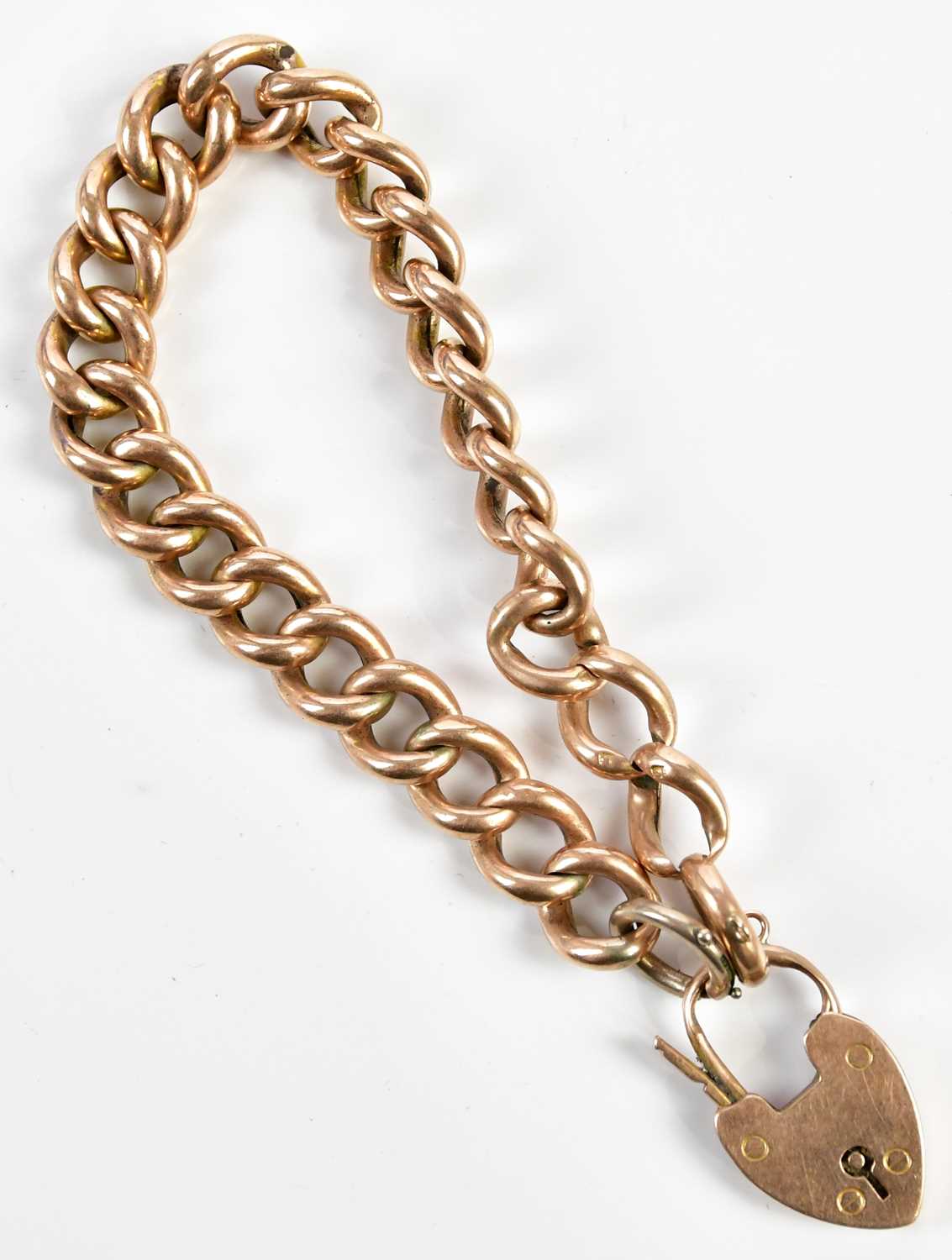 A 9ct yellow gold curb link bracelet with padlock clasp, approx 15.2g.