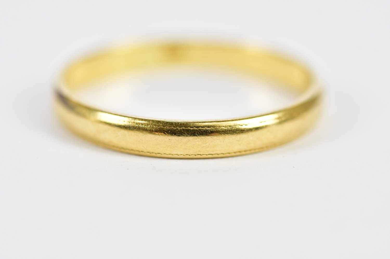 An 18ct yellow gold wedding band, size N 1/2, approx. 2.1g. - Image 2 of 3