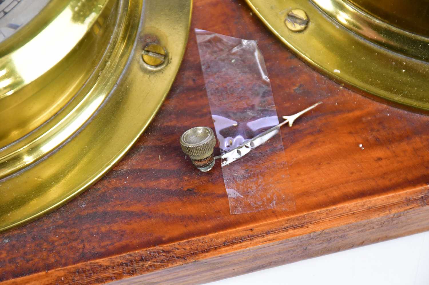 CAPTAIN O M WATTS; a brass cased ship's clock set with Roman and Arabic numerals, with thermometer - Image 4 of 4