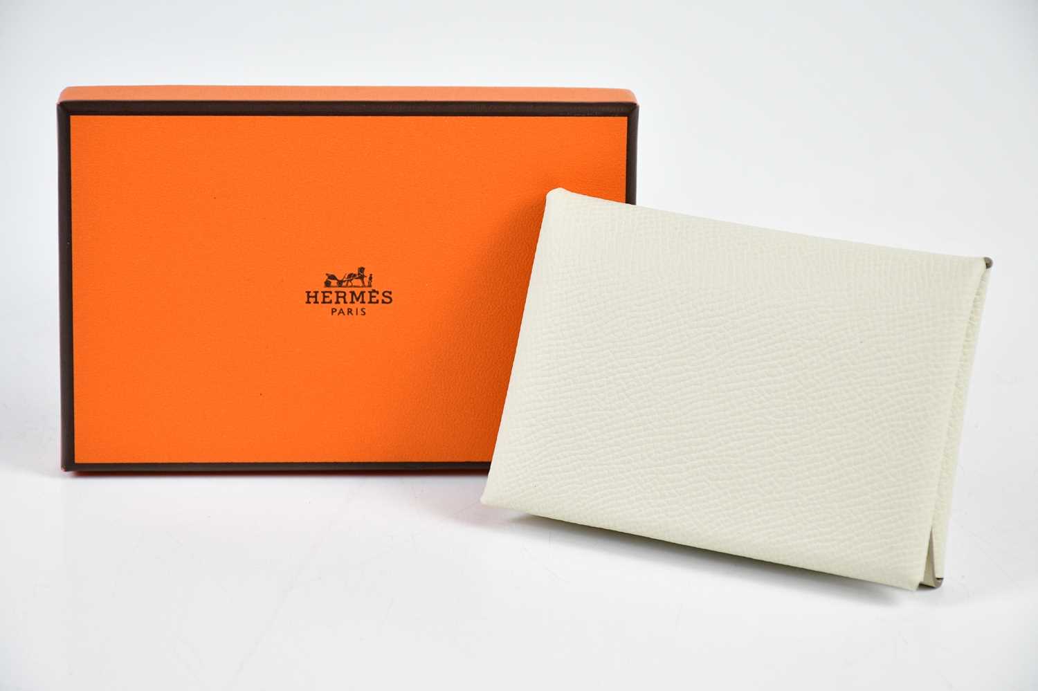 HERMÈS; an unused Calvi Epsom calfskin leather cream Duo compact card holder, in original box, 15