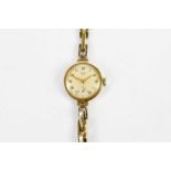 LIMIT; a vintage 9ct yellow gold wristwatch with Arabic numerals to the circular dial and sprung