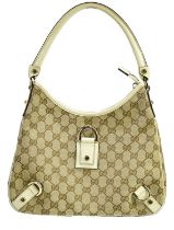 GUCCI; a monogram canvas GG D-ring shoulder bag, trimmed with cream leather, No. 150738, lined in