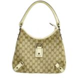 GUCCI; a monogram canvas GG D-ring shoulder bag, trimmed with cream leather, No. 150738, lined in