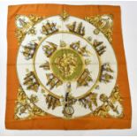 HERMÈS; a 100% silk Silhouettes Navales mustard, gold and green scarf depicting naval scenes, by