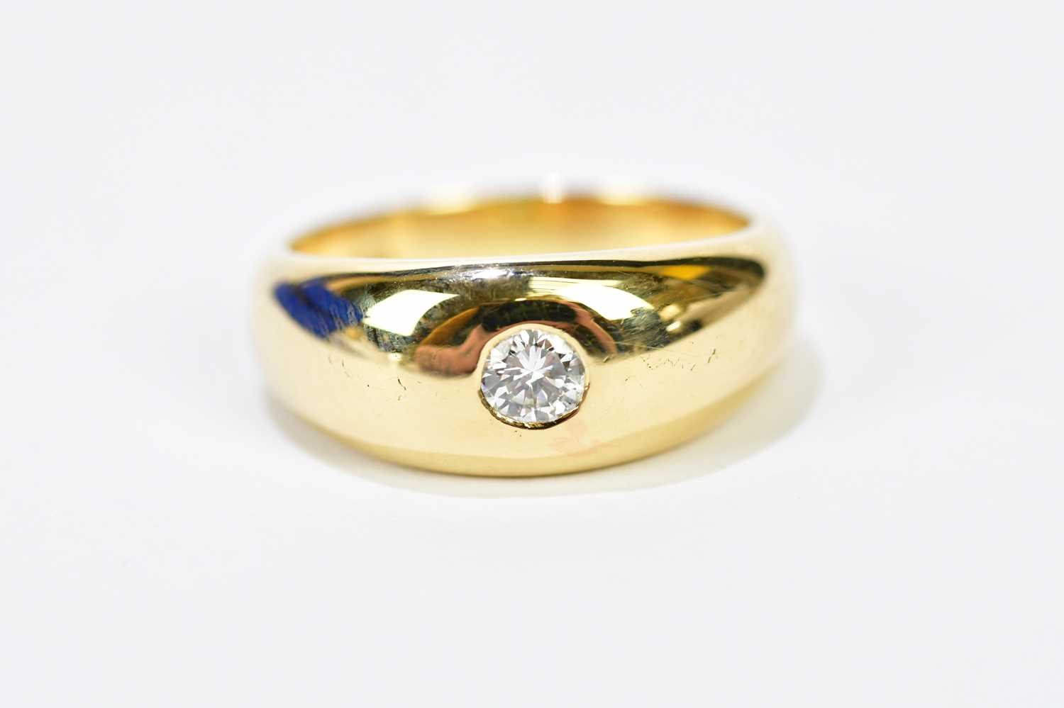 An 18ct yellow gold diamond solitaire ring, the single round brilliant cut stone weighing approx.