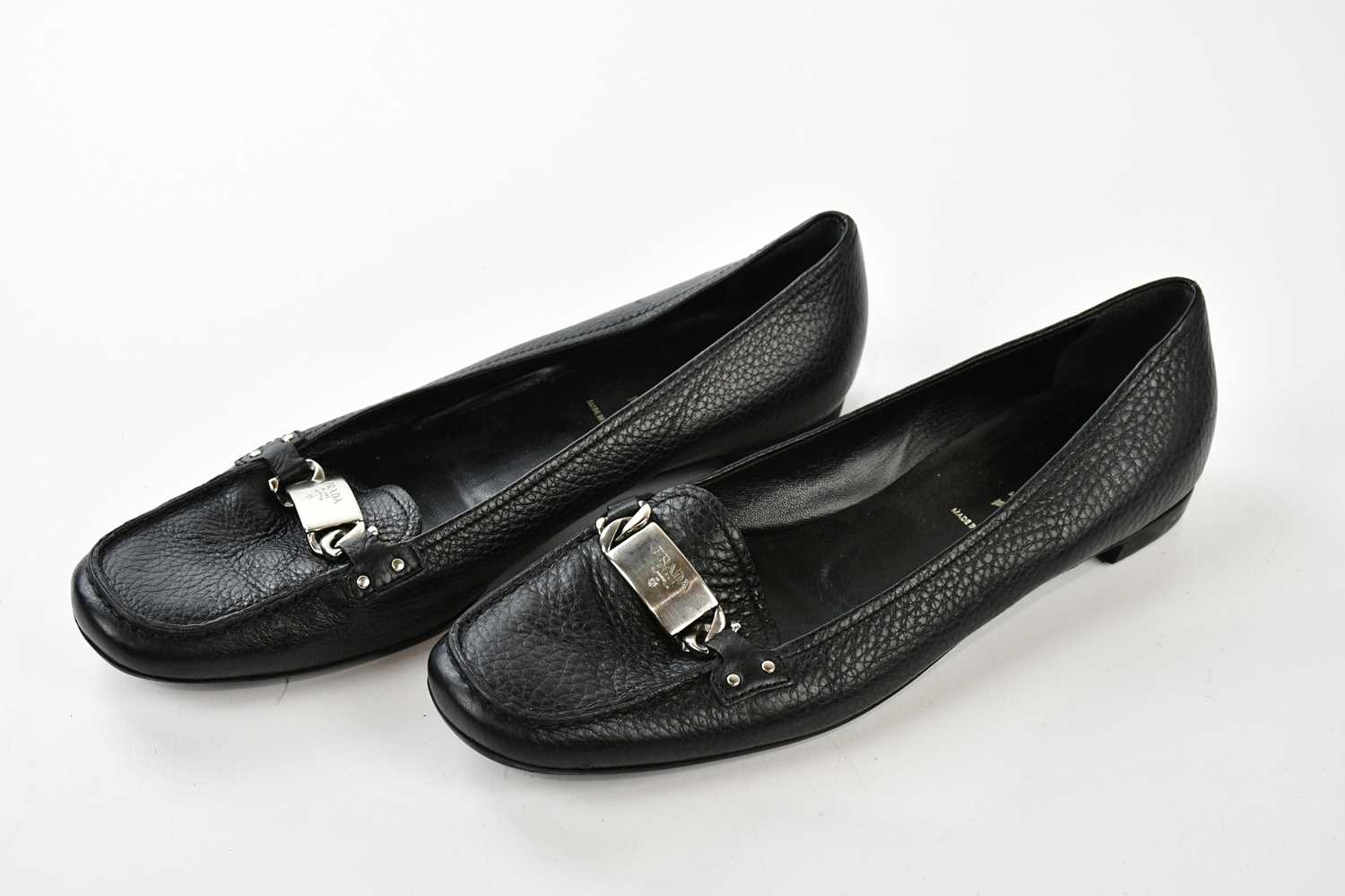 PRADA; a pair of black pebbled leather flat court shoes, embellished with silver tone buckle with - Bild 2 aus 2