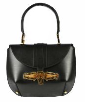 BALENCIAGA; a circa 2007 black calfskin leather Tron handbag, with large gold tone front metal