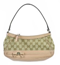 GUCCI; a Mayfair GG nude calfskin leather and GG canvas handbag, No. 269898, with front leather bow,