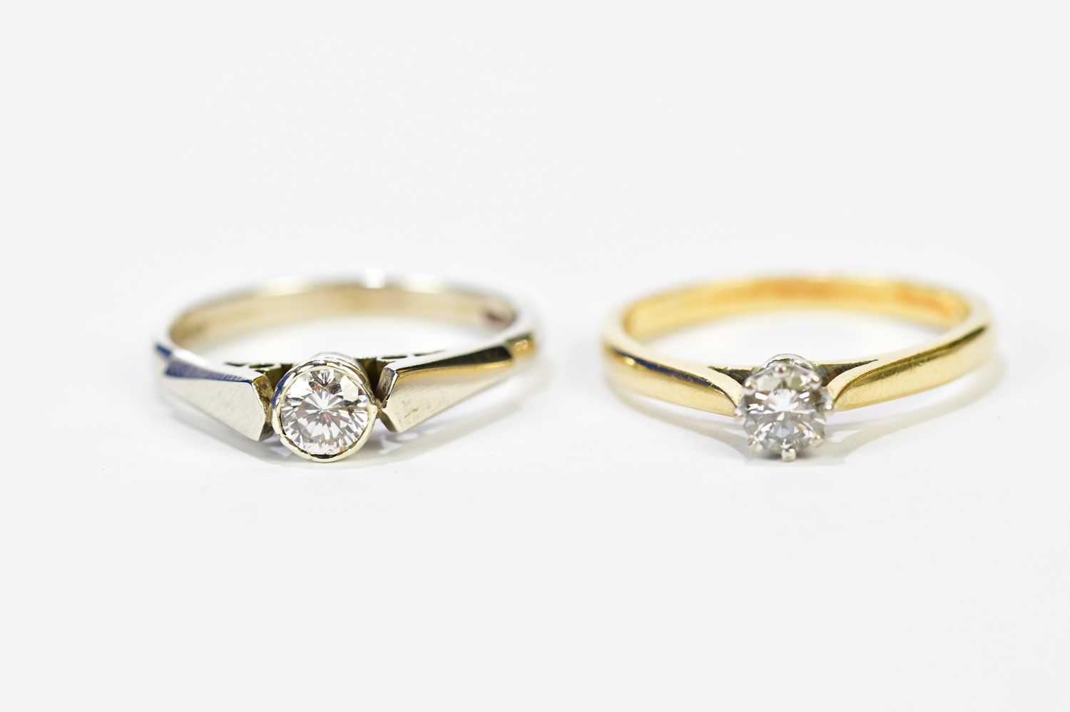 Two 9ct yellow gold diamond solitaire rings, one claw set, the other collet set, stones approx. 0.15