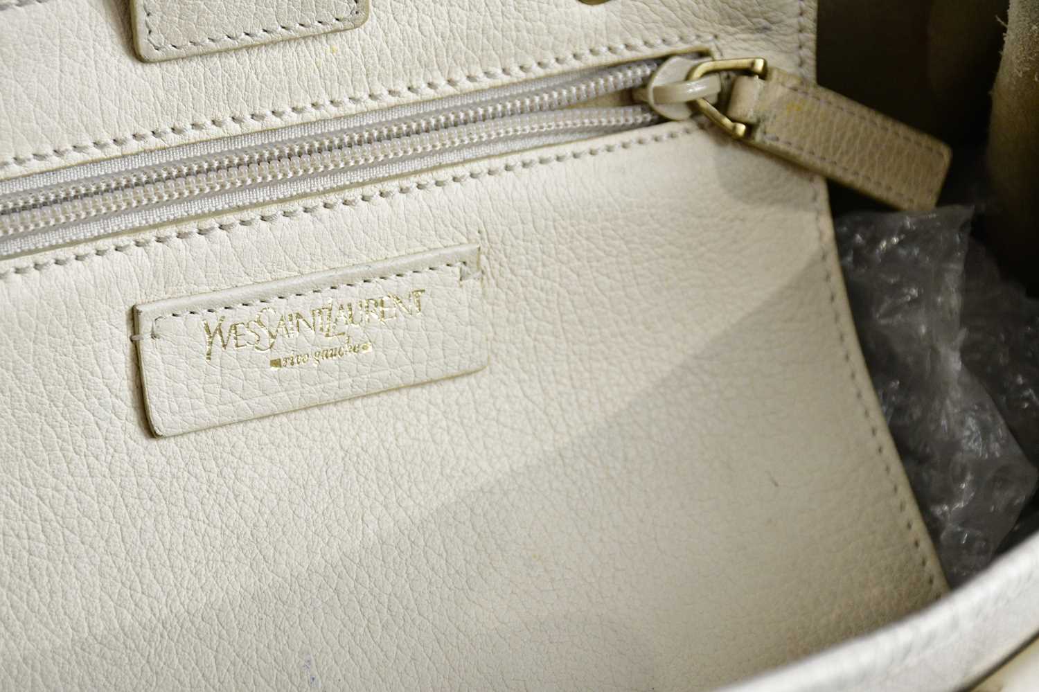 YVES SAINT LAURENT; a cream pebbled leather 'Y' bag with gold tone hardware buckles, and maker's - Image 3 of 3