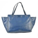 VALENTINO; a navy blue nappa leather Garavani Rock Stud medium handbag with gold tone metal studs