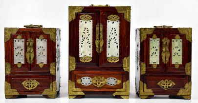 Three modern Chinese jewellery cabinets with applied brass and green hardstone mounts, largest