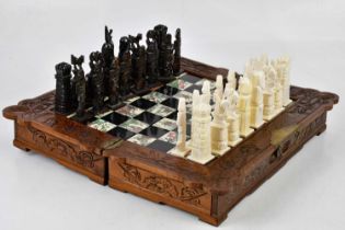 A modern Chinese chess set, height of kings 12.3cm , together with further chess set and board,