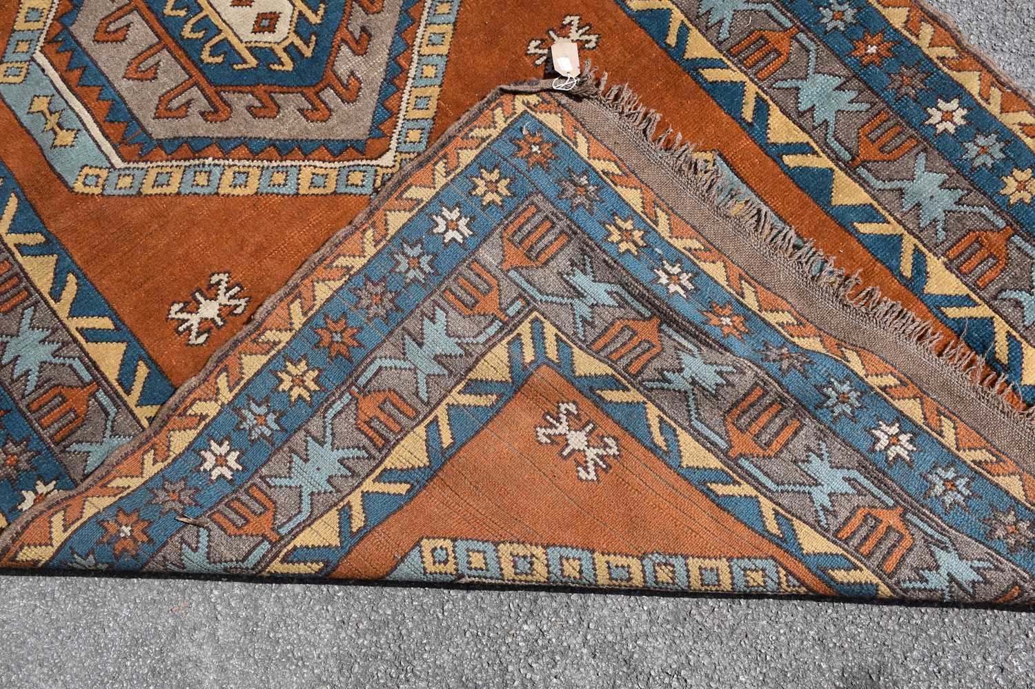 An orange ground Eastern style wool rug with geometric pattern, 210 x 140cm. - Image 3 of 3
