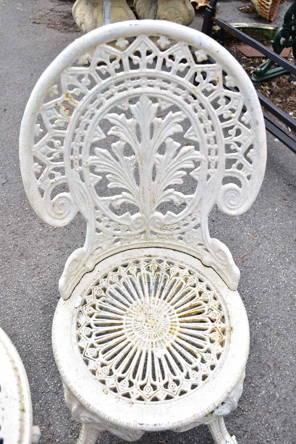 A pair of white painted cast iron chairs and a similar table (3). - Image 3 of 3