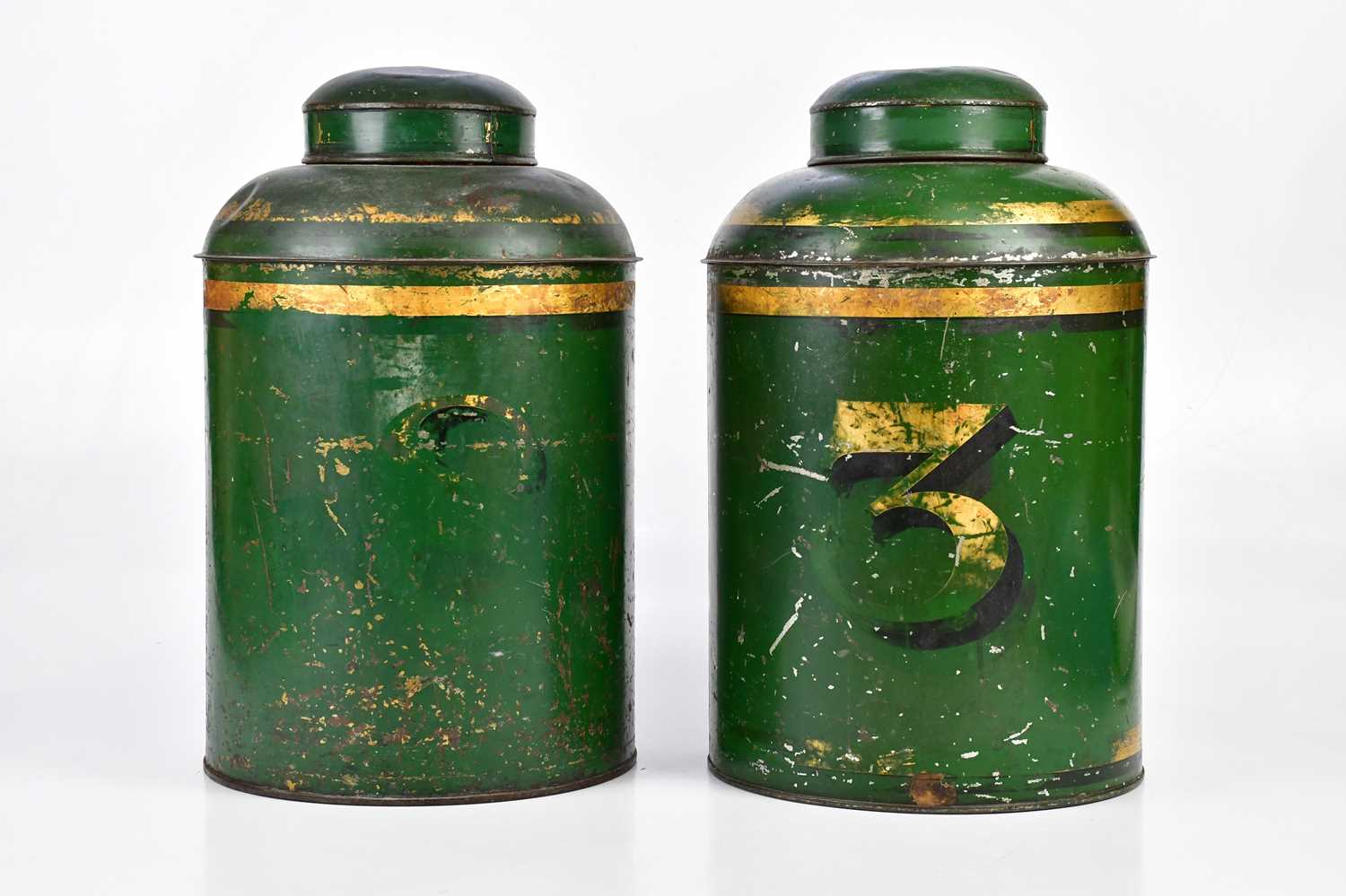 A pair of Victorian green painted cylindrical tea canisters, one example gilded with a numeral '