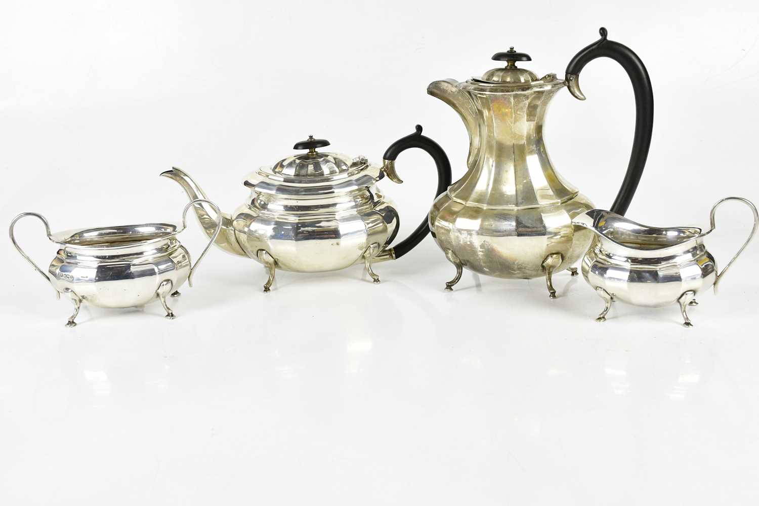 VINERS; a George VI hallmarked silver four piece tea service with panelled decoration, Sheffield