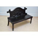 A Victorian settle with carved back on fluted front columns, width 170cm.