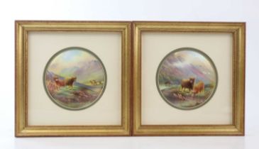 F MICKLEWRIGHT; a pair of hand painted Paragon plaques, Highland cattle, both signed, diameter 11.