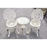 A pair of white painted cast iron chairs and a similar table (3).