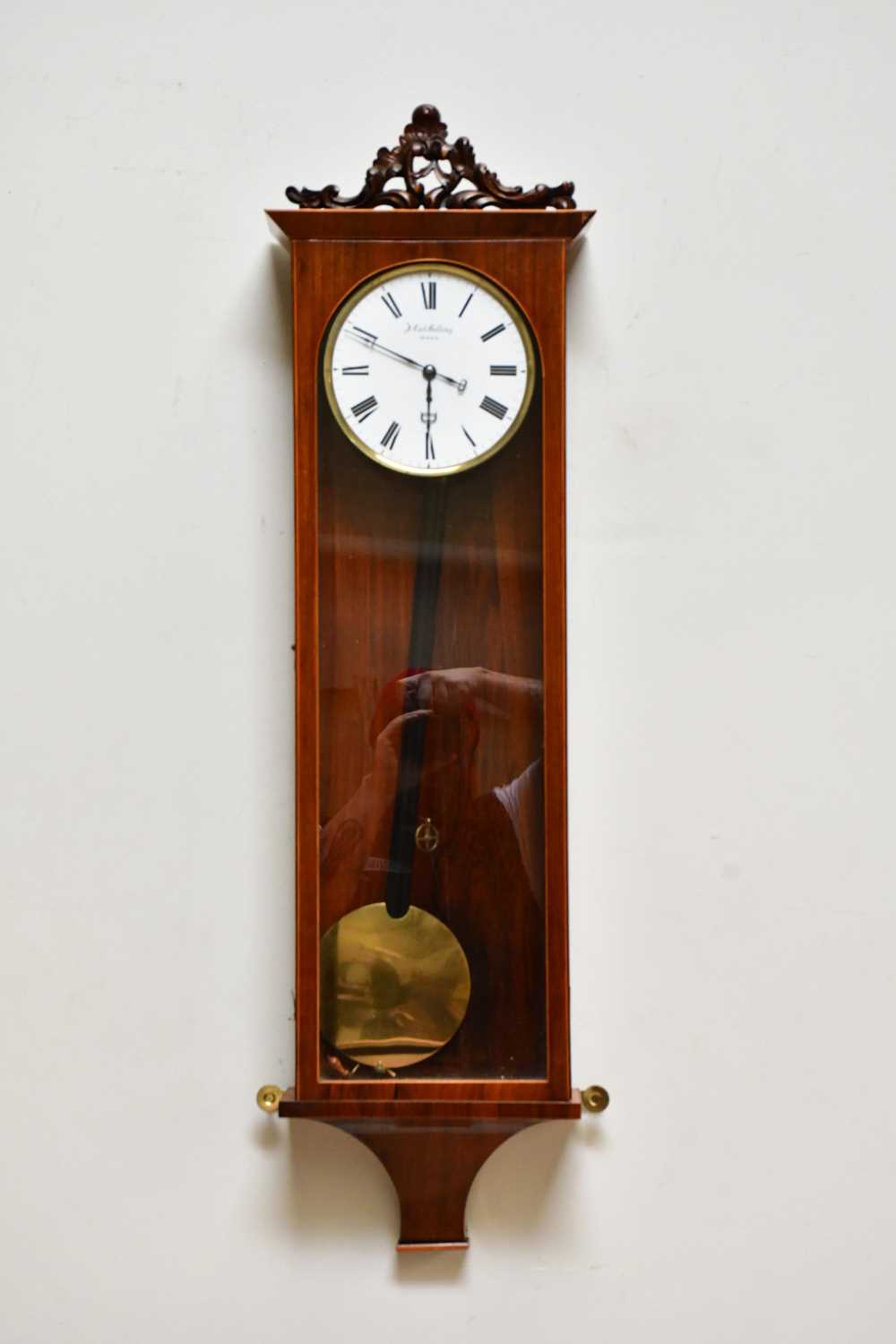 J CARL GOLLING; a rosewood cased and boxwood strung Biedermeier wall clock with white enamel dial