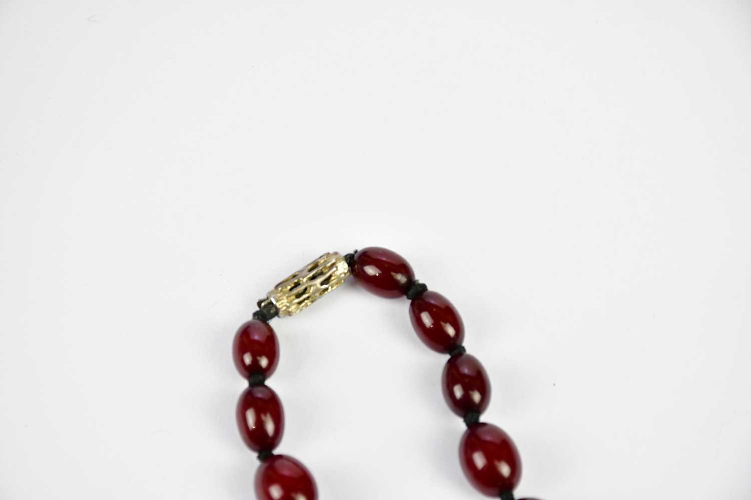 A cherry amber beaded necklace, length 43cm, approximate weight 44.4g. Condition Report: As - Image 3 of 9
