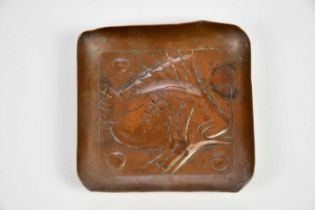MANNER OF NEWLYN; an Arts & Crafts copper dish of square form, embossed with a fish, 7 x 7cm.