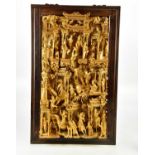 A Chinese gilt wood panel depicting figures in a temple scene within rosewood frame, overall 82 x