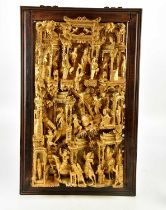 A Chinese gilt wood panel depicting figures in a temple scene within rosewood frame, overall 82 x