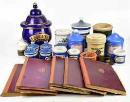 A collection of Victorian and later pharmaceutical items including ceramic jars, books including '