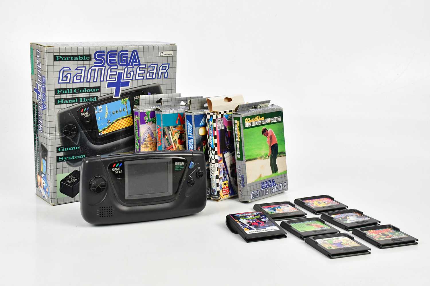 SEGA; a Game Gear + with original box and six games comprising of "Slider", "Micro Machines 2