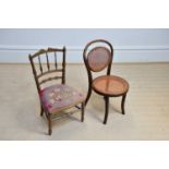 An early 20th century child's spindle back chair and a bentwood example (2).