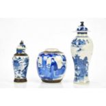Three pieces of Chinese crackle glaze comprising ginger jar and two lidded vases, largest 24cm.
