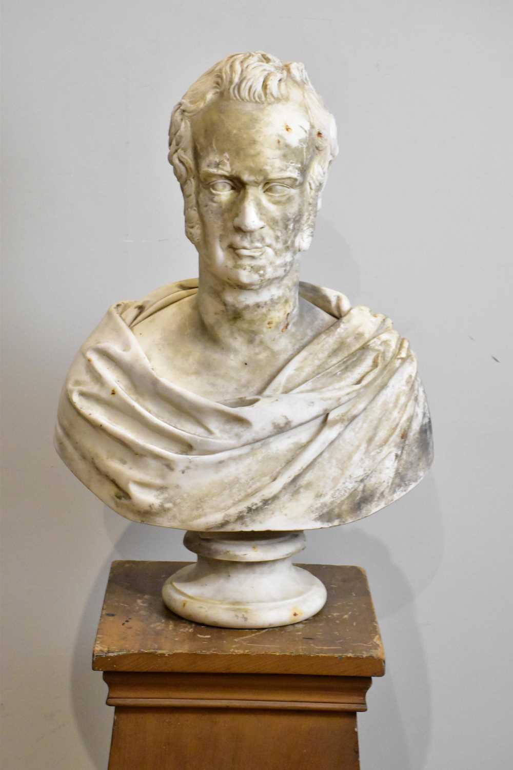 A 19th century marble bust of a gentleman upon a detachable base, height 67cm. Condition Report: The