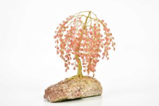 A decorative Chinese rose quartz and yellow metal model of a tree, height 19cm.