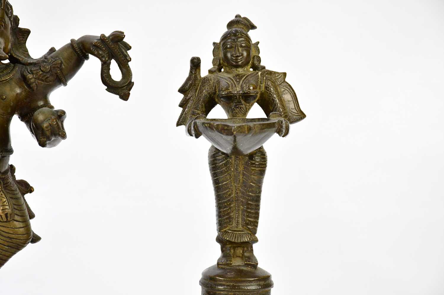 A bronze figure of Ganesh, together with a pair of bronze wick lamps, height of largest 29cm. - Image 5 of 8