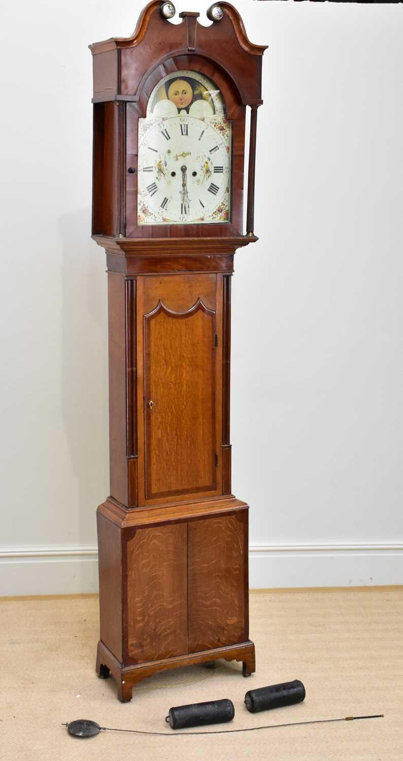 An early 19th century eight day longcase clock, with broken swan neck pediment with applied