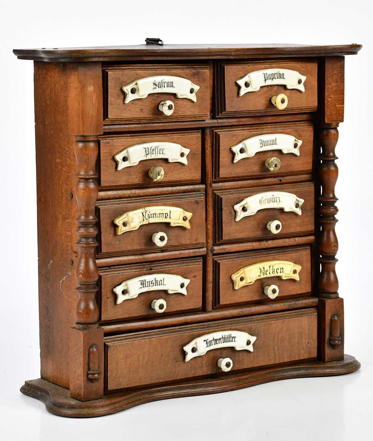 An early 20th century German nine drawer spice cabinet, height 28cm, width 30cm.