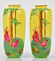 CROWN DUCAL; a pair of relief decorated vases, decorated with cockerels and hens in a landscape,