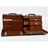 Two late 19th/early 20th century leather cased doctors' cases, the covers enclosing assorted drawers