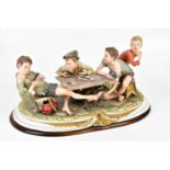 CAPODIMONTE; a large figure group, 'The Cheats', four boys playing cards, height 27cm. Condition