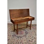 ARNOLD DOLMETSCH; a 20th century walnut cased clavichord, width 127.5cm.