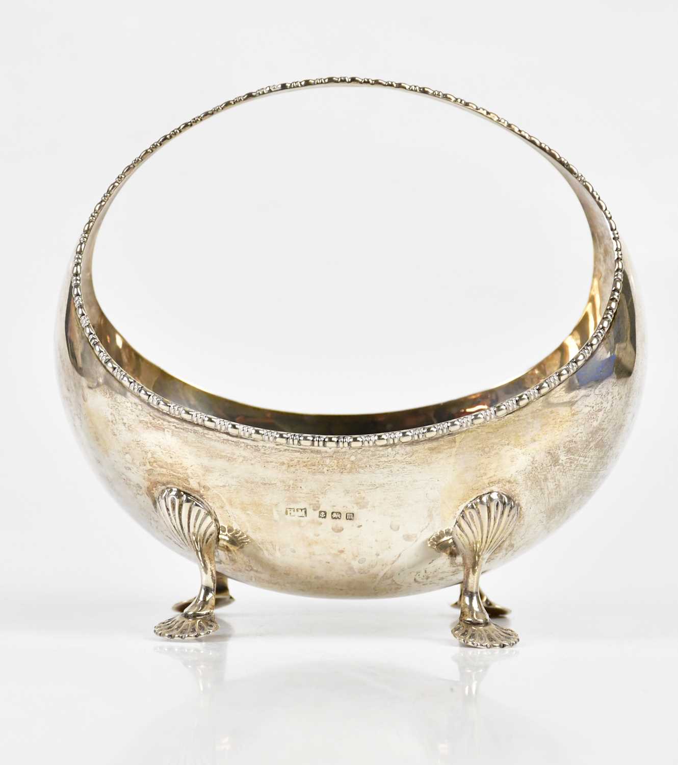 HENRY MATTHEWS; a George V hallmarked silver basket of oval form, with cast beaded rim, on four open