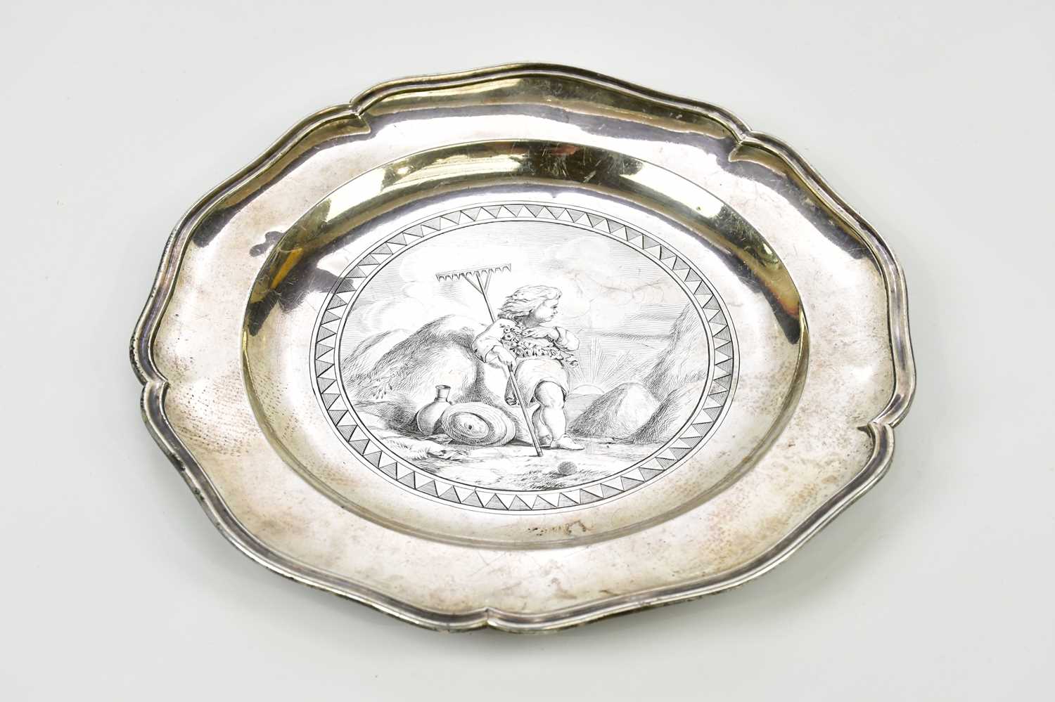 WILLIAM STROUD; a George III hallmarked silver dinner plate, with chased decoration to the centre